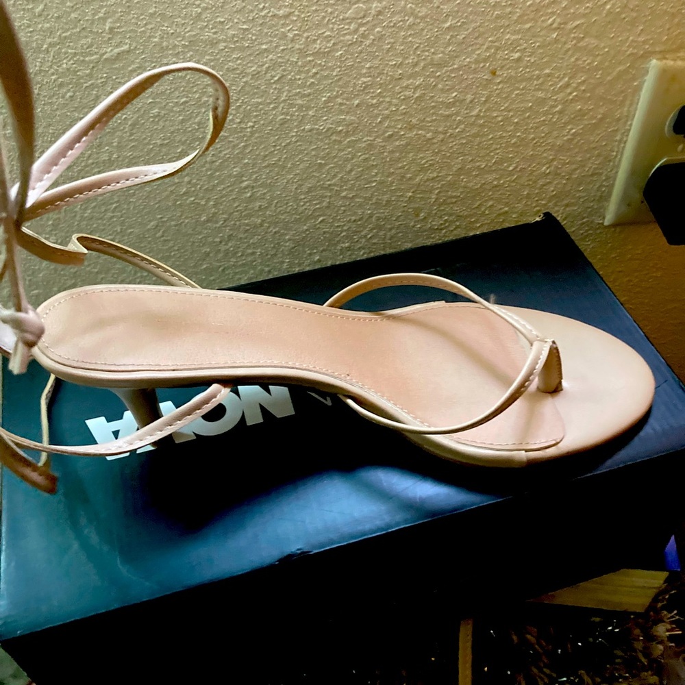 Nude open toe  with a cute heal-with 🦵🏾 lace up straps
